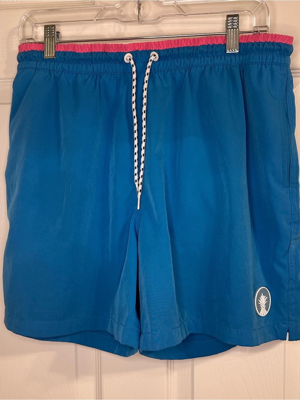 Chubbies Blue Swim Trunks with Pink Waistband and Pineapple Logo
